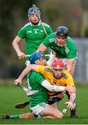 5 January 2020; Niall Deasy of Clare is tackled by Aaron Costello, Paddy O'Loughlin and David Reidy of Limerick during the Co-op Superstores Munster Hurling League 2020 Group A match between Clare and Limerick at O'Garney Park in Sixmilebridge, Clare. Photo by Harry Murphy/Sportsfile
