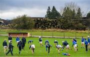 5 January 2020; The Laois panel warm-up ahead of the 2020 Walsh Cup Round 3 match between Laois and Westmeath at O'Keeffe Park in Borris in Ossory, Laois. Photo by Ramsey Cardy/Sportsfile