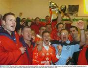 7 December 2003; St. Brigids' players and officials celebrate in their team dressing room after victory over Round Towers. AIB Leinster Club Senior Football Championship Final, St. Brigids v Round Towers, Pairc Tailteann, Navan, Co. Meath. Picture credit; David Maher / SPORTSFILE *EDI*