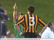 7 December 2003; Referee Eugene Murtagh, behind, shows the red card to Brian Kennedy, Round Towers. AIB Leinster Club Senior Football Championship Final, St. Brigids v Round Towers, Pairc Tailteann, Navan, Co. Meath. Picture credit; David Maher / SPORTSFILE *EDI*