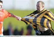 7 December 2003; Rory Gallagher, left, St. Brigids, grips the jersey of Glenn Ryan, Round Towers, during the game. AIB Leinster Club Senior Football Championship Final, St. Brigids v Round Towers, Pairc Tailteann, Navan, Co. Meath. Picture credit; David Maher / SPORTSFILE *EDI*