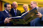 8 December 2003; Pictured at the launch of 'A Season of Sundays 2003', a collection of images from the 2003 Gaelic Games year by SPORTSFILE photographers, are from left, Sean Kelly, President of the GAA, Brian Cody, Kilkenny manager, Seamus Carroll, Managing Director of Carroll Meats, the official sponsor and SPORTSFILE  photographer, Ray McManus, in the Westin Hotel, Dublin. Picture credit; Damien Eagers / SPORTSFILE *EDI*
