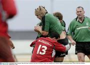 13 December 2003; Connacht's Mike McCarthy is tackled by Jean Marc Aue, Beziers. Parker Pen Challenge Cup, Connacht v Beziers, Sportsground, Galway. Picture credit; Ray McManus / SPORTSFILE *EDI*
