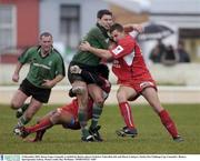 13 December 2003; Daren Yapp, Connacht, is tackled by Beziers players Federico Todeschini, left, and Murat Uanbayev. Parker Pen Challenge Cup, Connacht v Beziers, Sportsground, Galway. Picture credit; Ray McManus / SPORTSFILE *EDI*