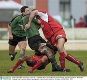 13 December 2003; Daren Yapp, Connacht, is tackled by Beziers players Federico Todeschini, left, and Murat Uanbayev. Parker Pen Challenge Cup, Connacht v Beziers, Sportsground, Galway. Picture credit; Ray McManus / SPORTSFILE *EDI*