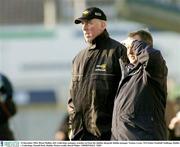 14 December 2003; Brian Mullins, left, Underdogs manager, watches on from the sideline alongside Dublin manager Tommy Lyons. TG4 Senior Football Challenge, Dublin v Underdogs, Parnell Park, Dublin. Picture credit; David Maher / SPORTSFILE *EDI*