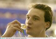 14 December 2003; Ireland's Andrew Bree kisses the Silver Medal he won in the Men's 200m Breaststroke Final. European Swimming Short Course Championships, National Aquatic Centre, Abbotstown, Dublin, Ireland. Picture credit; Brendan Moran / SPORTSFILE *EDI*