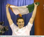 14 December 2003; Ireland's Andrew Bree holds the Irish tricolour aloft before receiving the Silver Medal he won in the Men's 200m Breaststroke Final. European Swimming Short Course Championships, National Aquatic Centre, Abbotstown, Dublin, Ireland. Picture credit; Brendan Moran / SPORTSFILE *EDI*