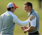 26 June 2013; Rory McIlroy, left, congratulates former AC Milan and Chelsea player Andriy Shevchenko on the 5th green during the Irish Open Golf Championship 2013 Pro Am. Carton House, Maynooth, Co. Kildare. Picture credit: David Maher / SPORTSFILE