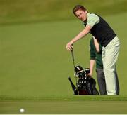 26 June 2013; Jockey Johnny Murtagh watches his putt on the 5th green during the Irish Open Golf Championship 2013 Pro Am. Carton House, Maynooth, Co. Kildare. Picture credit: Matt Browne / SPORTSFILE