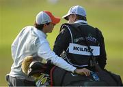 26 June 2013; Rory McIlroy places a water bottle into his golf bag held by his caddy JP Fitzgerald during the Irish Open Golf Championship 2013 Pro Am. Carton House, Maynooth, Co. Kildare. Picture credit: David Maher / SPORTSFILE