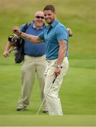 26 June 2013; Keith Duffy celebrates his long par putt on the 17th green during the Irish Open Golf Championship 2013 Pro Am. Carton House, Maynooth, Co. Kildare. Picture credit: Matt Browne / SPORTSFILE