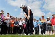 26 June 2013; Shane Lowry takes a pitch onto the 17th green blindfolded during the Irish Open Golf Championship 2013 Pro Am. Carton House, Maynooth, Co. Kildare. Picture credit: David Maher / SPORTSFILE