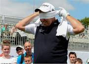 26 June 2013; Shane Lowry puts on a blindfold at the 17th green during the Irish Open Golf Championship 2013 Pro Am. Carton House, Maynooth, Co. Kildare. Picture credit: David Maher / SPORTSFILE