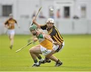 26 June 2013; Stephen Quirke, Offaly, in action against Padraig Walsh, Kilkenny. Bord Gáis Energy Leinster GAA Hurling Under 21 Championship Semi-Final, Offaly v Kilkenny, O'Connor Park, Tullamore, Co. Offaly. Picture credit: Pat Murphy / SPORTSFILE