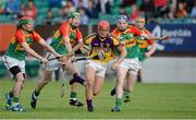 26 June 2013; Lee Chin, Wexford, in action against, from left, Craig Wall, Paul Cody, and Johnny Corcoran, Carlow. Bord Gáis Energy Leinster GAA Hurling Under 21 Championship Semi-Final, Wexford v Carlow, Dr. Cullen Park, Carlow. Picture credit: Brian Lawless / SPORTSFILE