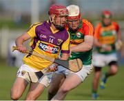 26 June 2013; Barry Carton, Wexford, in action against Paul Doyle, Carlow. Bord Gáis Energy Leinster GAA Hurling Under 21 Championship Semi-Final, Wexford v Carlow, Dr. Cullen Park, Carlow. Picture credit: Brian Lawless / SPORTSFILE