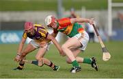26 June 2013; Paul Doyle, Carlow, in action against Barry Carton, Wexford. Bord Gáis Energy Leinster GAA Hurling Under 21 Championship Semi-Final, Wexford v Carlow, Dr. Cullen Park, Carlow. Picture credit: Brian Lawless / SPORTSFILE
