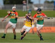 26 June 2013; Jack Hobbs, Wexford, in action against James Doyle, left, and Diarmuid Byrne, Carlow. Bord Gáis Energy Leinster GAA Hurling Under 21 Championship Semi-Final, Wexford v Carlow, Dr. Cullen Park, Carlow. Picture credit: Brian Lawless / SPORTSFILE