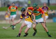 26 June 2013; Eoin Conroy, Wexford, in action against Daryl Roberts, Carlow. Bord Gáis Energy Leinster GAA Hurling Under 21 Championship Semi-Final, Wexford v Carlow, Dr. Cullen Park, Carlow. Picture credit: Brian Lawless / SPORTSFILE
