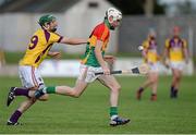 26 June 2013; Marty Kavanah, Carlow, in action against Jack Hobbs, Wexford. Bord Gáis Energy Leinster GAA Hurling Under 21 Championship Semi-Final, Wexford v Carlow, Dr. Cullen Park, Carlow. Picture credit: Brian Lawless / SPORTSFILE