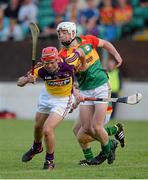 26 June 2013; Garret Foley, Wexford, in action against James Doyle, Carlow. Bord Gáis Energy Leinster GAA Hurling Under 21 Championship Semi-Final, Wexford v Carlow, Dr. Cullen Park, Carlow. Picture credit: Brian Lawless / SPORTSFILE