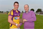 26 June 2013; Ian Byrne, Wexford, is presented with the Bord Gáis Energy Man of the Match award by Dave Kirwan, Managing Director, Bord Gáis Energy. Bord Gáis Energy Leinster GAA Hurling Under 21 Championship Semi-Final, Wexford v Carlow, Dr. Cullen Park, Carlow. Picture credit: Brian Lawless / SPORTSFILE