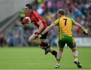 23 June 2013; Keith Quinn, Down, in action against Anthony Thompson, Donegal. Ulster GAA Football Senior Championship Semi-Final, Donegal v Down, Kingspan Breffni Park, Cavan. Picture credit: Brian Lawless / SPORTSFILE