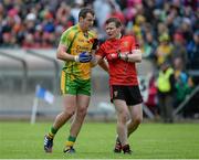 23 June 2013; Down's Daniel McCartan tries to get to grips with Donegal's Michael Murphy. Ulster GAA Football Senior Championship Semi-Final, Donegal v Down, Kingspan Breffni Park, Cavan. Picture credit: Brian Lawless / SPORTSFILE