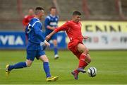 28 June 2013; Larlar Radulascm, FAI FAS Carrigaline, in action against Craig McMarlow, FAI FAS Limerick. Bobby Smith Cup Final, FAI FAS Limerick v FAI FAS Carrigaline, Dalymount Park, Dublin. Picture credit: David Maher / SPORTSFILE