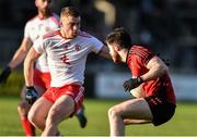 12 January 2020; Ciaran Harney of Down in action against Niall Kelly of Tyrone during the Bank of Ireland Dr McKenna Cup Semi-Final match between Tyrone and Down at the Athletic Grounds in Armagh. Photo by Oliver McVeigh/Sportsfile