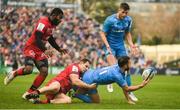 12 January 2020; Jamison Gibson-Park of Leinster offloads the ball to team-mate Ross Byrne as he is tackled by Jeremie Maurouard of Lyon during the Heineken Champions Cup Pool 1 Round 5 match between Leinster and Lyon at the RDS Arena in Dublin. Photo by David Fitzgerald/Sportsfile