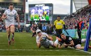 18 January 2020; Will Addison of Ulster dives to score his side's third try despite the tackle from Gabe Hamer-Webb of Bath during the Heineken Champions Cup Pool 3 Round 6 match between Ulster and Bath at Kingspan Stadium in Belfast. Photo by Oliver McVeigh/Sportsfile