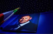 18 January 2020; A photo of former Dublin GAA football team manager Jim Gavin stands alongside an Irish tricolour at the Conferring of the Honorary Freedom of Dublin City on Jim Gavin ceremony in the Round Room at the Mansion House, in Dawson St, Dublin. Photo by Brendan Moran/Sportsfile