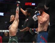 18 January 2020; Conor McGregor has his hand raised by referee Herb Dean following his UFC 246 Welterweight bout with Donald Cerrone at the T-Mobile Arena in Las Vegas, Nevada, USA. Photo by Mark J. Rebilas / USA TODAY Sports via Sportsfile