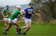 5 January 2020; Aaron Dunphy of Laois in action against  Robbie Greville of Westmeath during the 2020 Walsh Cup Round 1 match between Laois and Westmeath at O'Keeffe Park in Borris in Ossory, Laois. Photo by Ramsey Cardy/Sportsfile