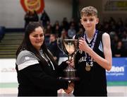 20 January 2020; Sean Fitzpatrick of Malahide Community School is presented the trophy by Chief Operations Officer Louise O'Loughlin during the Basketball Ireland U16 A Boys Schools Cup Final between Malahide Community School and St Patrick's College, Cavan at the National Basketball Arena in Tallaght, Dublin. Photo by Harry Murphy/Sportsfile