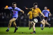 22 January 2020; David Garland of DCU Dóchas Éireann has a shot on goal despite the attention of Martin O'Connor of UCD during the Sigerson Cup Semi-Final match between DCU Dóchas Éireann and UCD at Dublin City University Sportsgrounds in Glasnevin, Dublin. Photo by Ben McShane/Sportsfile