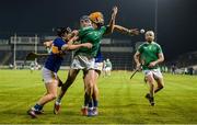 25 January 2020; Richie English of Limerick gets a handpass away to team-mate Tom Condon under pressure from in Willie Connors and John McGrath of Tipperary during the Allianz Hurling League Division 1 Group A Round 1 match between Tipperary and Limerick at Semple Stadium in Thurles, Tipperary. Photo by Diarmuid Greene/Sportsfile
