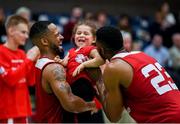 25 January 2020; Puff Summers and Darren Townes of Griffith College Templeogue celebrate with his daughter Kennedy Summers, aged three, following the Hula Hoops Pat Duffy National Cup Final between DBS Éanna and Griffith College Templeogue at the National Basketball Arena in Tallaght, Dublin. Photo by Harry Murphy/Sportsfile