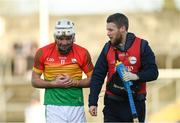 26 January 2020; Martin Kavanagh of Carlow, alongside physio Paul Kelly, leaves the field after picking up an injury during the Allianz Hurling League Division 1 Group B Round 1 match between Clare and Carlow at Cusack Park in Ennis, Clare. Photo by Diarmuid Greene/Sportsfile
