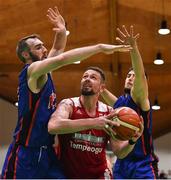 25 January 2020; Jason Killeen of Griffith College Templeogue in action against Mark Reynolds, left, and Marko Tomic of DBS Eanna during the Hula Hoops Pat Duffy National Cup Final between DBS Éanna and Griffith College Templeogue at the National Basketball Arena in Tallaght, Dublin. Photo by Brendan Moran/Sportsfile