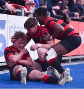 30 January 2020; Daniel O'Neill of Kilkenny College, left, is congratulated by team-mates Adam Strong, centre, and Joshua Akanji Murphy after making the tackle to deny the Wesley College try following the Bank of Ireland Leinster Schools Senior Cup First Round match between Kilkenny College and Wesley College at Energia Park in Dublin. Photo by Ben McShane/Sportsfile