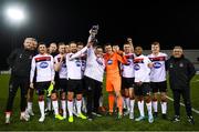 30 January 2020; Dundalk players and supporter Cillian Malone celebrate with the trophy following the Jim Malone Cup match between Dundalk and Drogheda United at Oriel Park in Dundalk, Co Louth. Photo by Harry Murphy/Sportsfile