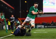 31 January 2020; Thomas Ahern of Ireland escapes the tackle of Rufus McLean of Scotland on his way to scoring his side's fifth try during the U20 Six Nations Rugby Championship match between Ireland and Scotland at Irish Independent Park in Cork. Photo by Harry Murphy/Sportsfile