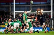 1 February 2020; Conor Murray of Ireland under pressure from Jonny Gray of Scotland as he kicks down field during the Guinness Six Nations Rugby Championship match between Ireland and Scotland at the Aviva Stadium in Dublin. Photo by Seb Daly/Sportsfile