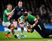 1 February 2020; Bundee Aki with the support of his Ireland team-mate Andrew Conway, left, is tackled by Rory Sutherland, 1, and Stuart Hogg of Scotland during the Guinness Six Nations Rugby Championship match between Ireland and Scotland at the Aviva Stadium in Dublin. Photo by Ramsey Cardy/Sportsfile