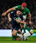 1 February 2020; Ali Price of Scotland is tackled by John Cooney and Josh van der Flier of Ireland during the Guinness Six Nations Rugby Championship match between Ireland and Scotland at the Aviva Stadium in Dublin. Photo by Brendan Moran/Sportsfile