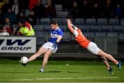 1 February 2020; Evan O’Carroll of Laois kicks to score a point despite the efforts of Aaron McKay of Armagh during the Allianz Football League Division 2 Round 2 match between Laois and Armagh at MW Hire O'Moore Park in Portlaoise, Laois. Photo by Sam Barnes/Sportsfile