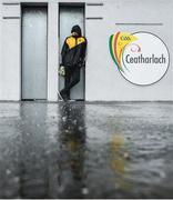 2 February 2020; Kilkenny supporter Gary Farrell shelters from torrential rain in an unopened turnstile prior to gates opening before the Allianz Hurling League Division 1 Group B Round 2 match between Carlow and Kilkenny at Netwatch Cullen Park in Carlow. Photo by David Fitzgerald/Sportsfile